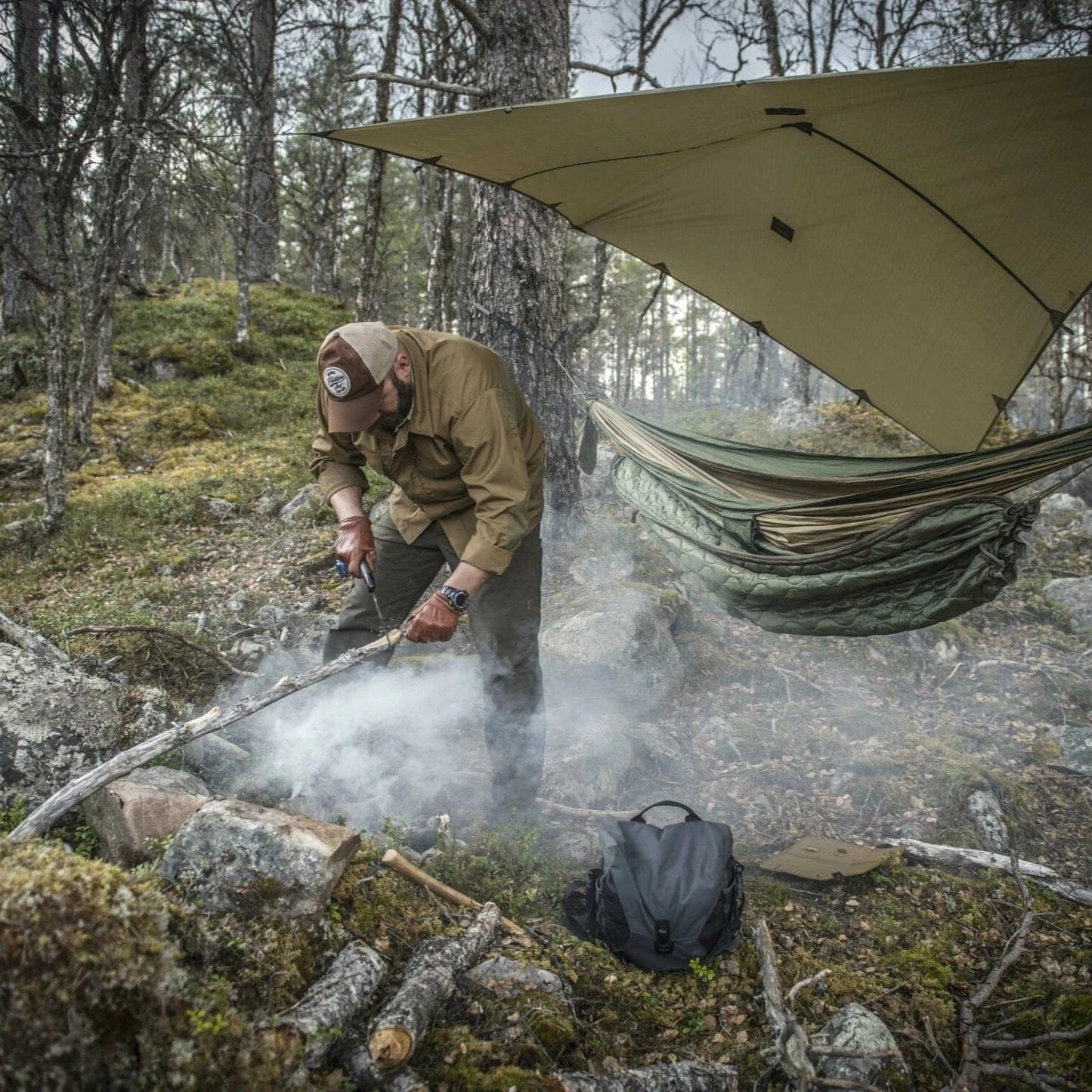 Supertarp camouflaged perfectly among fallen leaves and grass